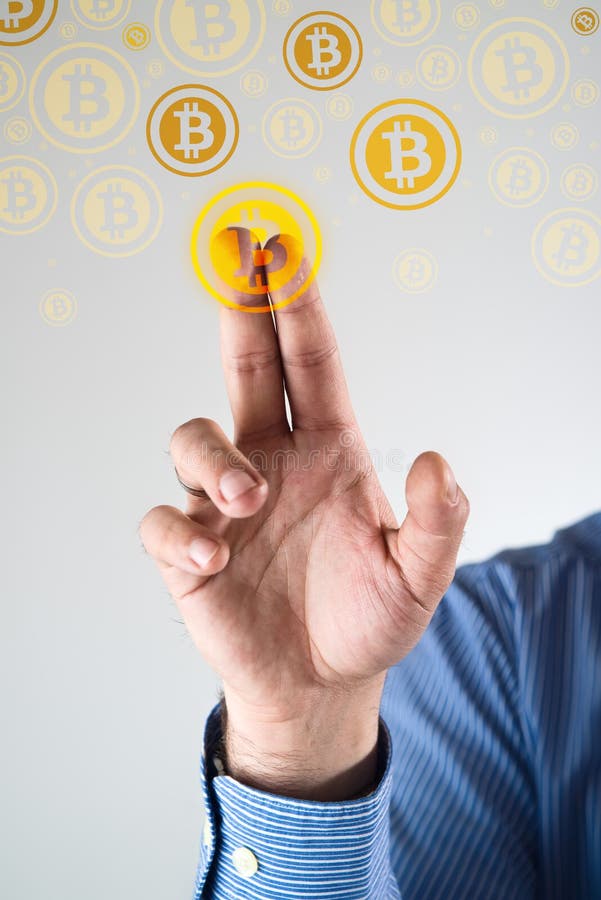 Collecting bitcoins. Businessman pressing bitcoin icon. Conceptual image stock photography
