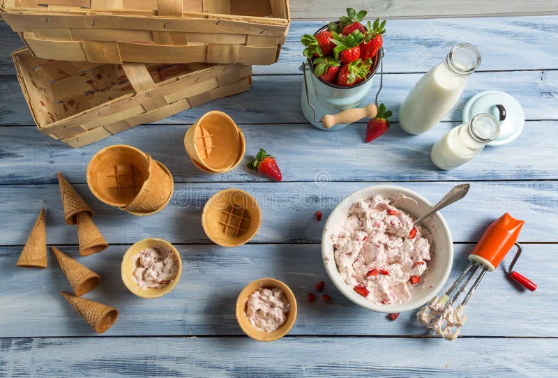 Homemade production of strawberry ice cream stock photography