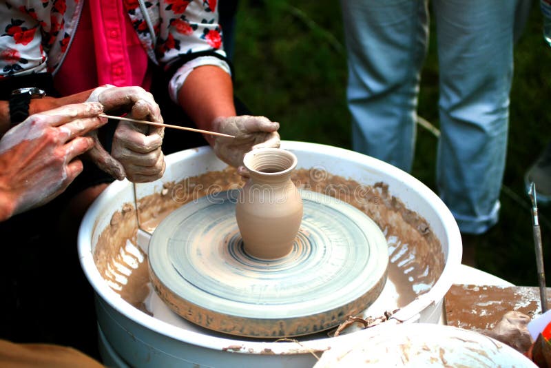 Learning pottery craft. Master class for clay modeling. Earthenware jug making.  stock photos