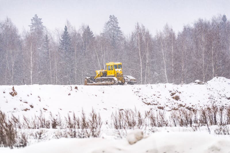 Snow clearing. Tractor clears the way after heavy snowfall. Snow clearing. Tractor clears the way after heavy snowfall stock image