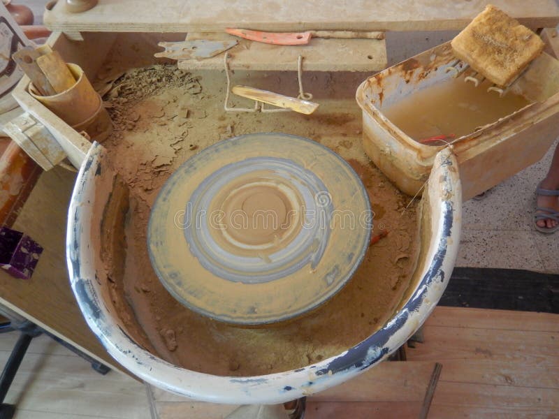 Top view of a electrically rotating potter& x27;s wheel, stacked mud on it to make potter products. Top view of a electrically rotating potter& x27;s wheel stock image