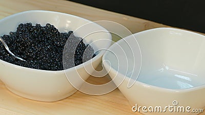 Black Sturgeon and red salmon caviar. Miraculously appear in the cup stock footage