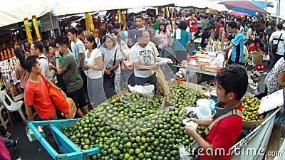 Selling citrus at flea market stock video