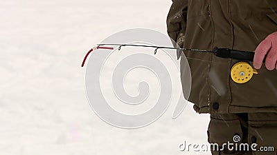 Fishermen fishing winter fishing for trout and sturgeon on a paid pond on ice. Winter fishing for trout and sturgeon on a paid pond on ice stock footage